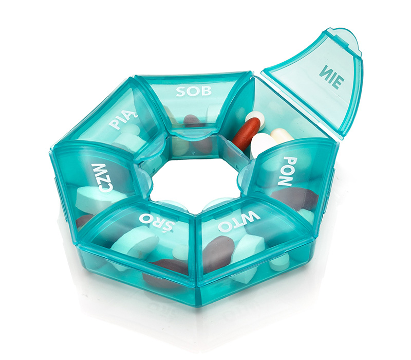 dávkovač léků v okrouhlé krabičce